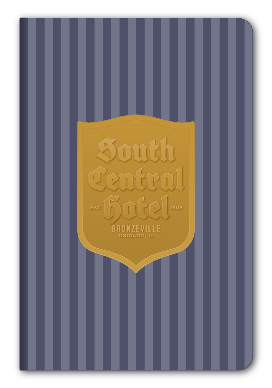 A rectangular notebook or journal with a navy and slate blue vertical striped cover, featuring a gold shield-shaped emblem in the center that reads 'South Central Hotel' and 'Bronzeville Chicago IL'.